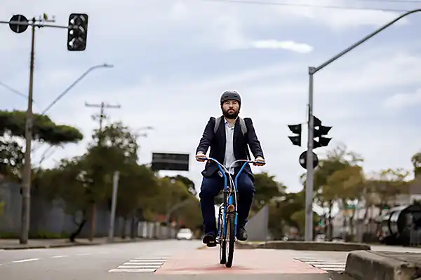 Bicyclist crossing safely at stoplight intersection