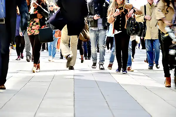 Pedestrian walking at crosswalk intersection 