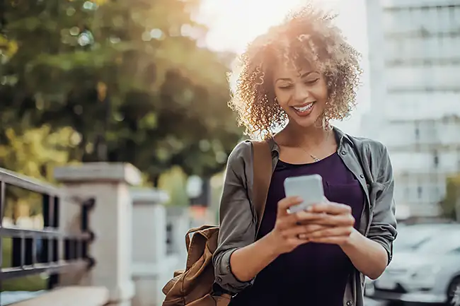 Women using Umo App smiling