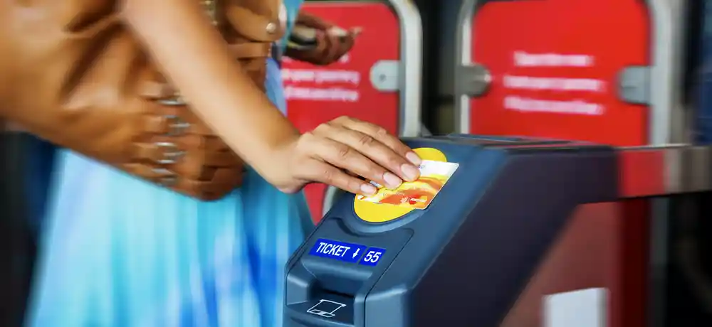 woman in blue dress tapping gate